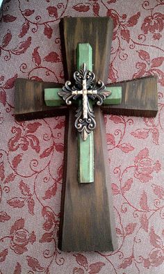 a wooden cross sitting on top of a table