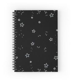 a black notebook with white stars on it