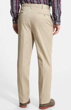 A classic flat front details sharp, office-ready trousers fashioned from soft, wrinkle-resistant cotton. 32" inseam; 19" leg opening; 12" front rise; 18" back rise (size 33/32) Zip fly with hook-and-eye closure Side-seam pockets; back button-welt pockets 100% cotton Machine wash, tumble dry Imported Men's Clothing Fitted Chinos For Business Casual With Pockets, Fitted Chino Cotton Twill Bottoms With Belt Loops, Full-length Chinos With Belt Loops For Business Casual, Business Casual Full-length Chinos With Belt Loops, Business Casual Full Length Chinos With Belt Loops, Fitted Chinos With Pockets For Semi-formal Occasions, Fitted Semi-formal Chinos With Pockets, Fitted Chinos For Semi-formal Occasions, Fitted Cotton Chinos For Semi-formal Occasions