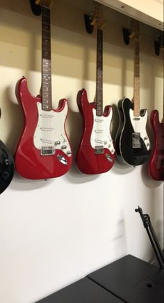 guitars hanging on the wall in a music studio