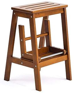 a wooden step stool with one foot on the seat and two legs off the ground