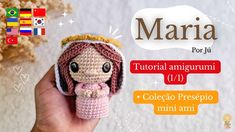 a crocheted doll with a crown on it's head in front of a white background