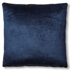 a blue velvet pillow on a white background