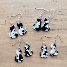 These adorable cat earrings measure approximately 1.5" long, with the ear wires drop included, and .75" at their widest. Each pair varies in color and patterns, making them unique! The ear wires shown in the photos are stainless steel, but for an additional fee, sterling silver is available! Cute Cat Design Adjustable Earrings, Adjustable Cute Cat Design Earrings, Cute Adjustable Cat Design Earrings, Cat Earrings, Etsy Earrings Dangle, Black & White, Ear Wires, Sterling Silber, Cute Cats