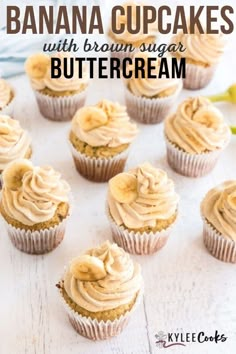 banana cupcakes with brown sugar buttercream on a white wooden table and bananas in the background