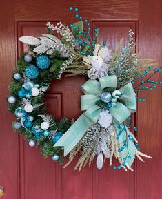 This Christmas Wreath with Green Bows is glamorous, sparkly, and unique. If you are looking for a chic, elegant and glam wreath for this Christmas, this wreath would be the best one for you! This wreath is detailed with lots of Blue, Silver, and White Christmas balls, pines, and mint Green Ribbon.   This piece has a dimension of 24"Lx25"Wx6"H. This measurement is based on leaf tip to leaf tip. This wreath is made of a 16" wired wreath base. Check my ETSY Shop here: https://www.etsy.com/shop/FloralDesignedByMae For more inquiries please message me and I accept customize orders also. White Christmas Balls, Elegant Christmas Wreath, Turquoise Wreath, Christmas Wreath For Front Door, Bows Christmas, Pretty Wreath, Holiday Glam, Christmas Wreaths For Front Door, Green Bows