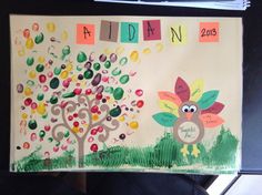 a child's drawing of a turkey and tree with the name adin on it