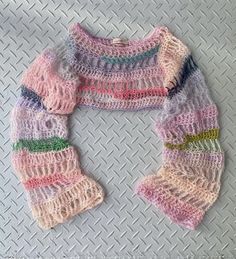 a knitted sweater with multicolored stripes on it