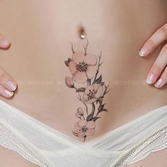 a woman's stomach with flowers on it