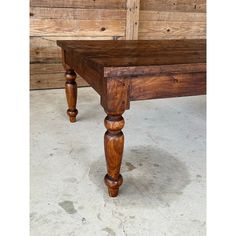 an old wooden table with turned legs