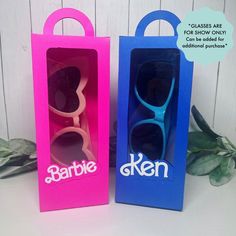 two blue and pink sunglasses in a box with the words barbie written on one side