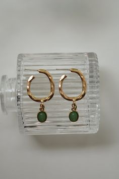 Our Dusk of Hope Earrings have a one of a kind twisted hoop that connects to a green pendant. These earrings are super light weight and dainty! Color - Green & Gold Material - Stainless Steel Measurements - 1.75 Inches Long Green Wire-wrapped Dangle Hoop Earrings, Green Wire Wrapped Dangle Hoop Earrings, Trendy Wire Wrapped Drop Earrings, Green Hoop Earrings With Ear Wire, Green Minimalist Brass Earrings, Minimalist Green Brass Earrings, Green Metal Hoop Earrings As A Gift, Green Circular Hoop Earrings As A Gift, Green Pierced Everyday Earrings