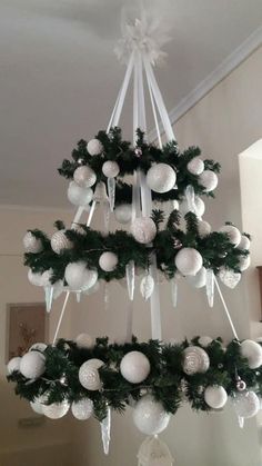 a white christmas tree hanging from the ceiling