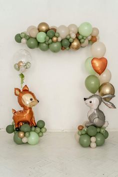 balloons are arranged in the shape of an animal and deer on top of each other