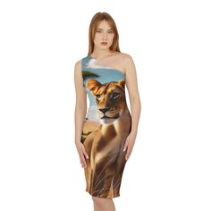 "Embrace the grace and power of the Serengeti with this stunning one-shoulder dress, featuring the majestic lioness. Just as the lioness prowls the savanna with silent, calculated steps, you will stride into any room with confidence and poise. The sleek, tawny coat of the lioness, beautifully printed on the dress, symbolizes inner strength and allure. This dress is more than just a fashion statement; it embodies the fierce, unstoppable spirit of the queen of the savanna. Whether you're seeking t Lion And Lioness, Inspired Fashion, Inner Strength, Dress Clothes For Women, Simple Dresses, Fashion Statement, One Shoulder Dress, Print Dress, Shoulder Dress