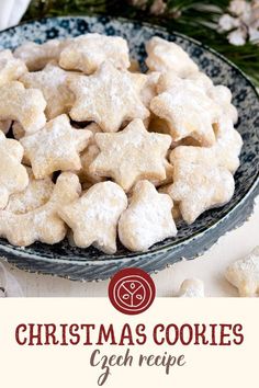 a bowl full of christmas cookies on top of a table