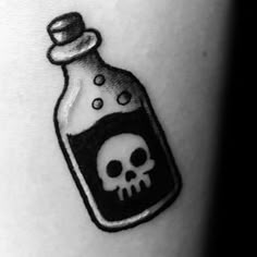 a bottle with a skull in it on the arm