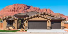 a house with mountains in the background