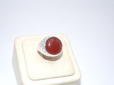 "Up for your consideration is this Vintage Sterling Silver Ring by LUC. This ring is set with a beautiful carnelian cabochon in the center with a scale-like texture throughout the rest of the ring. Pictures best describe. Excellent condition, no dents or damage. The inside of the ring is hallmarked: \"LUC\", \"925\", \"CN\".  Ring Size is Approx.: 7.5 Measurement of Ring is Approx.: 3/4 inches wide across the top I tested this piece with acid and it is guaranteed to be sterling silver. E-mail me Carnelian Ring, Vintage Sterling Silver Rings, Ring Pictures, Rings Statement, Sterling Silber, Vintage Sterling Silver, Sterling Silver Ring, Statement Rings, Silver Ring