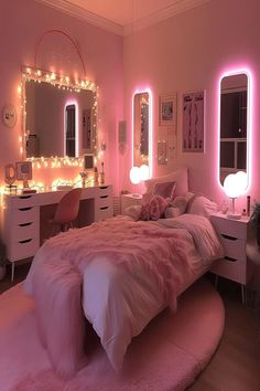 a bedroom decorated in pink and white with lights on the wall above the bed, dressers and mirror