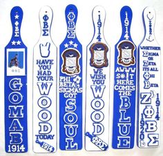 four blue and white snow skis with different designs on them