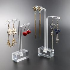 Description This earring display holder is small in size, can be easily put on most desks or counters, not taking up much space. Provide an easy and quick way to organize and display your earring and ear stud. Wide uses, suitable for personal use, retail shop, jewelry shop, shopping mall, direct broadcasting room, etc. Features -Color:Transparent -Material:Acrylic -Size:13.50X8.00X2.00cm/5.31X3.14X0.79in (Tall) -Size:11.50X8.00X2.00cm/4.52X3.14X0.79in (Low) - Great for displaying your earrings, Earring Holder Stand, Earring Display Stand, Hanging Earring, Stand Jewelry, Earring Display Stands, Hanging Jewelry Organizer, Acrylic Earring, Jewelry Chest, Jewelry Display Stands