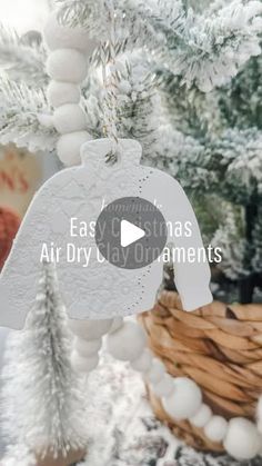 an ornament hanging from a christmas tree with the words easy christmas air dry clay ornaments