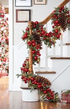 christmas garland and pine cones on the banister