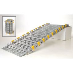 a long metal conveyor belt with yellow wheels on the bottom and side rails attached to it