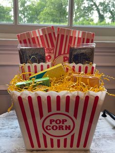 a popcorn bucket filled with lots of candy