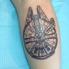 a black and white photo of a star wars tattoo