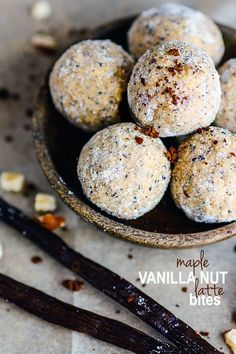 a wooden bowl filled with cookies on top of a table