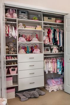 the closet is filled with lots of baby clothes and other things to put in it