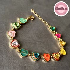 Elevate your style with our exquisite Enchanting Harmony: Vibrant Love Heart Bracelet - a celebration of love and color that captivates hearts and turns every moment into a magical experience. Whether you're stepping out for a casual day with friends or adding a touch of charm to a special occasion, this bracelet effortlessly complements your style. Its versatile design allows you to express your personality with ease. Heart-shaped Multicolor Bracelets For Mother's Day, Party Heart Beads Bracelet, Party Heart Beads Charm Bracelet, Multicolor Jewelry For Valentine's Day Party, Party Heart Shape Charm Bracelet With Heart Beads, Gold Bracelets For Valentine's Day Party, Valentine's Day Heart Beads Charm Bracelet For Party, Gold Heart Bracelet For Valentine's Day Party, Valentine's Day Party Charm Bracelet With Heart Beads