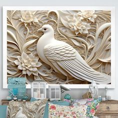 a white peacock sitting on top of a couch next to a wall mounted art piece