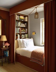 an image of a bedroom with red curtains and a bed in the corner, which is also on instagram