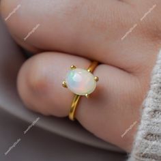 Gemstone : Natural Ethiopian Opal Metal : 9K Gold / 14K Gold / 18K Gold / 925S Silver Gemstone Shape and Size : Oval 9x7 MM Gemstone Weight : 2.10 Cts Metal Weight :  3.00 Gram ACCEPT CUSTOM SERVICE: 1. Accept change main stone type, size : Oval 9x7 MM 2. Accept change other material : This jewelry can also be made in solid gold (14K white/rose/yellow gold...) Please contact me if you have special requests. Thanks for your visiting! Dainty Gold Opal Ring For Anniversary, Gold Opal Promise Ring In Fine Jewelry Style, Gold Opal Jewelry With Prong Setting, Yellow Gold Sterling Silver Couple Rings, Stamped 14k Oval Opal Wedding Ring, White Hallmarked Birthstone Wedding Ring, Gold Sterling Silver Opal Ring For Anniversary, Gold Opal Gemstone Promise Ring, Gold Opal Ring In Sterling Silver