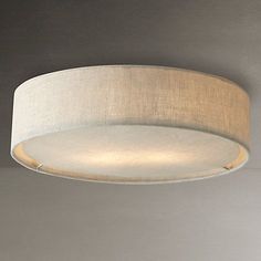 a white ceiling light with a beige shade on the top and bottom part of it