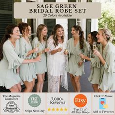 the bridesmaids are all dressed in sage green robes and holding champagne glasses together