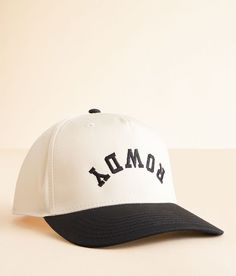 a white and black hat with the word bomba printed on it's front