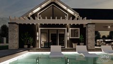 a house with a pool and lounge chairs in the front yard at night, lit up by lights