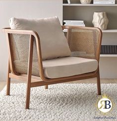 a chair that is sitting on top of a rug in front of a book shelf