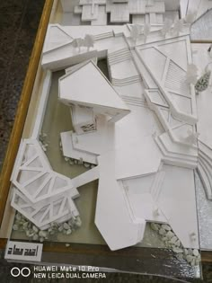 a model of a building made out of white paper