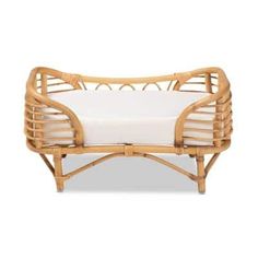 an image of a couch made out of wood and rattan with white linen on it