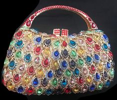 New Gold Multi Color Crystal Petal Crystal Design Evening Handbag Colors Available: Silver With Iridescent Crystal Ruby Red Pink Rose Gold With Pastel Multi Color Crystal Gold With Rain Bow Crystal Gold With Amber Crystal Elegant Multicolor Top Handle Shoulder Bag, Multicolor Party Pouch Bag, Multicolor Pouch Bag For Party, Elegant Multicolor Top Handle Bag, Multicolor Handheld Bag For Formal Occasions, Luxury Multicolor Handheld Clutch, Multicolor Rectangular Party Bag, Multicolor Clutch For Evening, Multicolor Handheld Shoulder Bag For Party