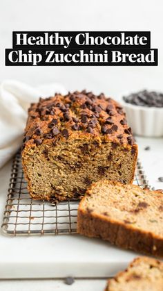 a loaf of chocolate chip banana bread on a cooling rack