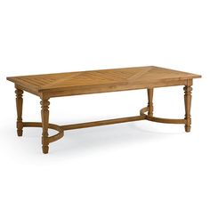 a wooden table sitting on top of a white floor