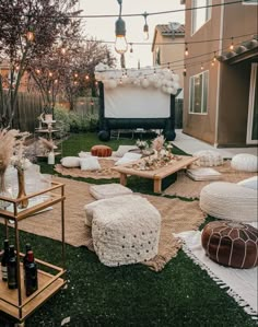 an outdoor movie is set up in the backyard