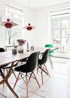 a dining room table and chairs with the words dining room inspiration eames chairs on it