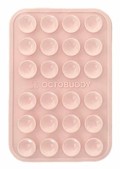 a pink plastic tray with lots of bubbles on the bottom and words that read, octubudy